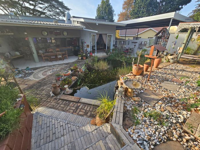 For Sale: Unique House in Kingsview Ext 1 with 8 Carports, Pool, and Log Cabin.