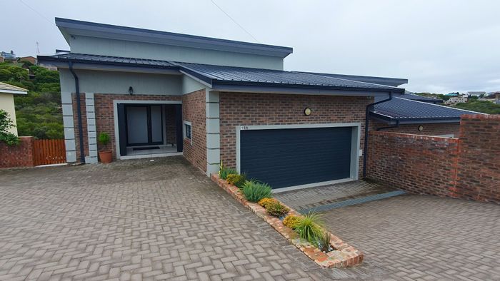 For Sale: House in Dana Bay with 3 bedrooms, double garage, and valley views.