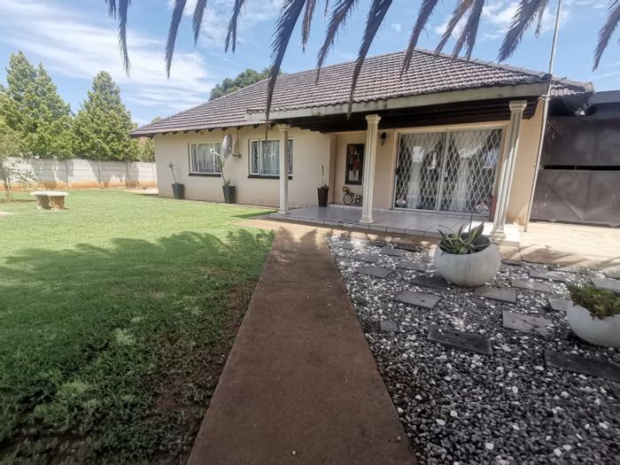 For Sale: House in Stilfontein Ext 4 with 3 beds, lapa, workshop, and flatlet potential.