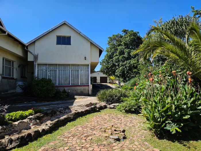 For Sale: House in Fontainebleau with multiple rental units, pool, and garden.