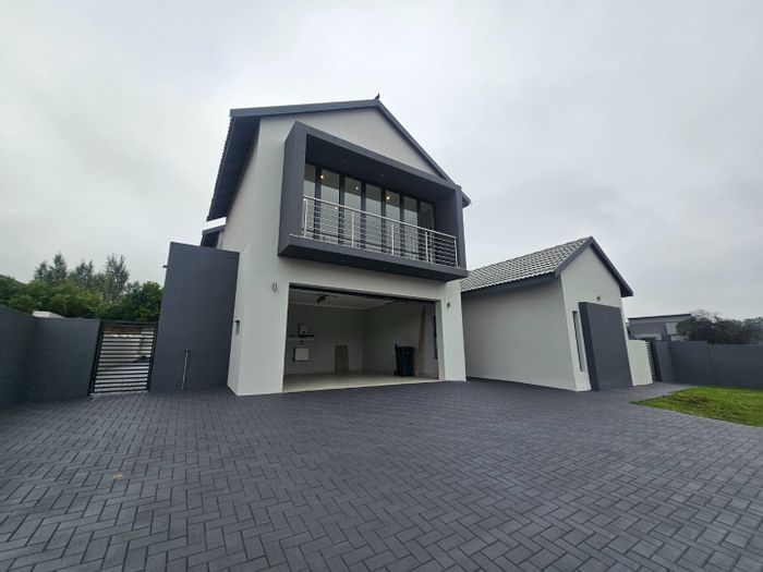 For Sale: 4-Bedroom House in Eldoraigne with patio, automated garage, and scullery.