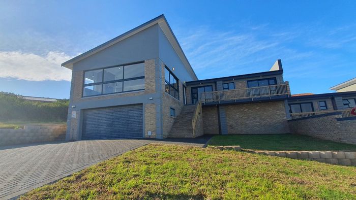 For Sale: 3-Bedroom House in Dana Bay with Ocean Views, Double Garage, and Balcony.