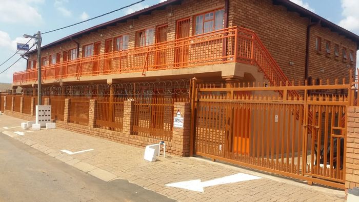 For Sale: House in Mahube Valley with 36 rental units and secure parking.