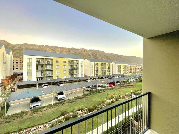 1-Bedroom Apartment To Rent in Greenbay Eco Estate with secure parking and balcony views.