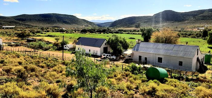 Oudtshoorn Rural Farm For Sale: Self-sufficient, solar-powered with abundant water sources.