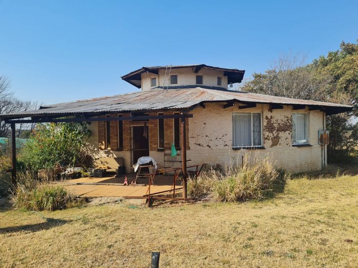 Farm for Sale in Klerksdorp Rural: 12 hectares, boreholes, livestock facilities, two houses.