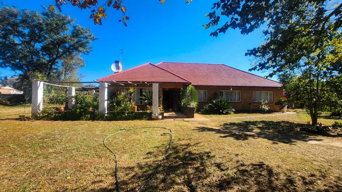 Spacious 4-bedroom house with study, double garage, and large yard in Stilfontein Ext 2. For Sale.