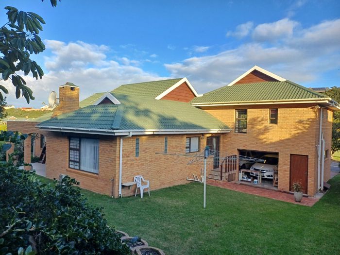 Hersham House For Sale: 4 beds, 3 baths, open-plan living, dual garages.