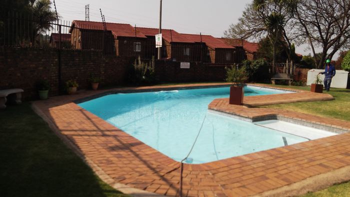 For Sale: 2-Bedroom Apartment in Northcliff with Pool and Garage, Offers Welcome.
