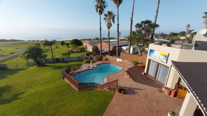 For Sale: 9-bedroom house in Winterstrand with ocean views, pool, and garage.