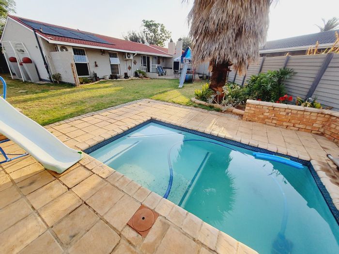 Family-friendly townhouse in Elarduspark with pool, flat, and secure complex. For Sale!