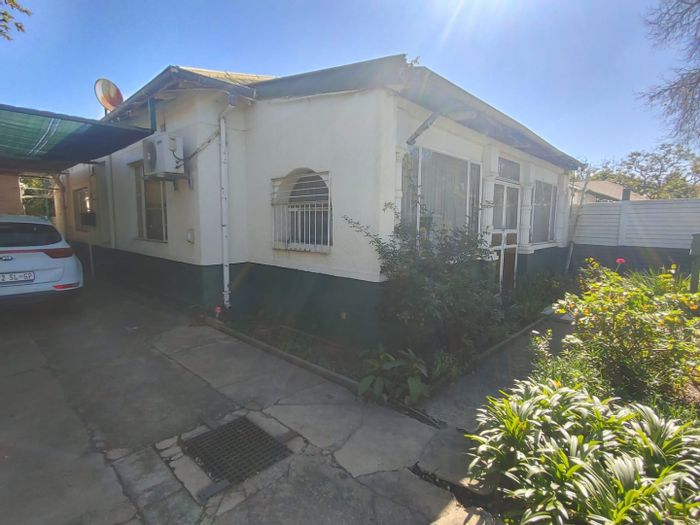 For Sale: House in Pretoria West with business rights, spacious yard, and potential.
