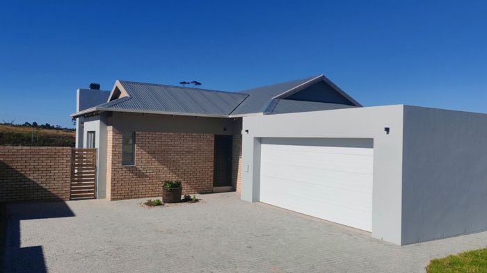 3-Bedroom House For Sale in Mooikloof Country Estate with patio, garage, and garden.