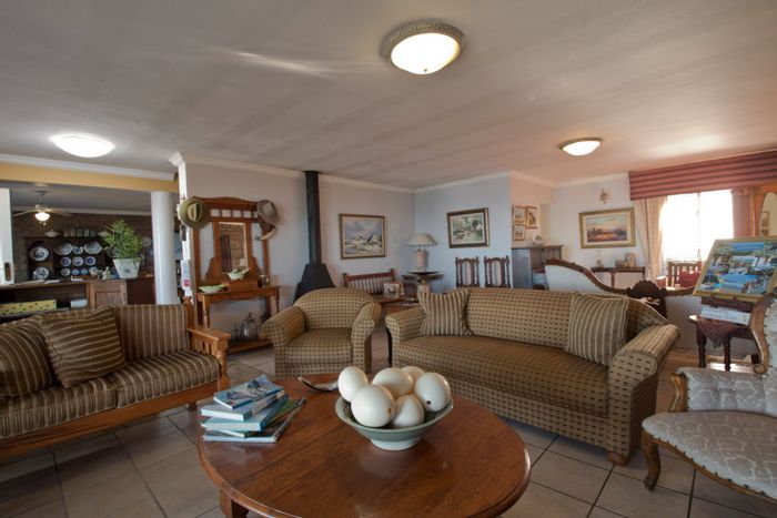 For Sale: House in Dana Bay with 11 guest units, pool, and sea views.