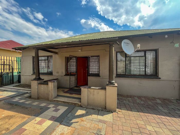 For Sale: 2-bedroom house in Rosettenville with rental potential and secure parking.