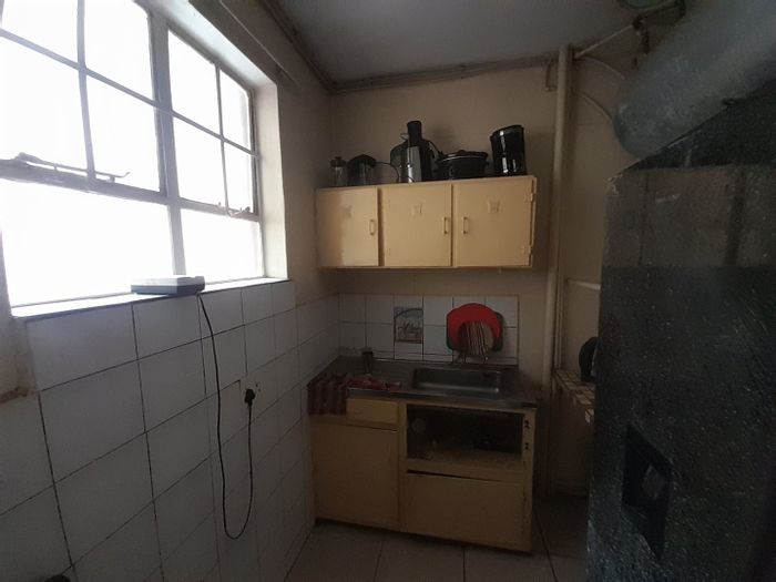 Bachelor apartment for sale in Pretoria Central with balcony and investment potential.