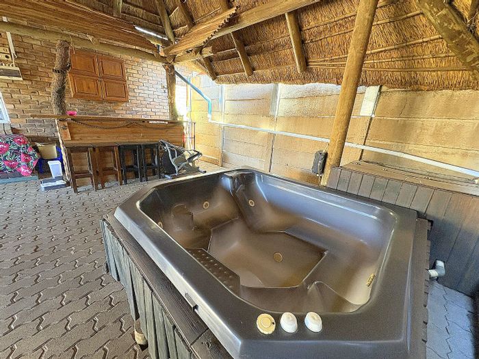 3-Bedroom Townhouse in Rooihuiskraal North with lapa, hot tub, and garden services. For Sale.