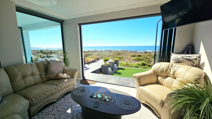 For Sale: House in Sandy Point Beach Estate with ocean views, koi pond, and rental units.