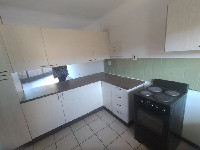 For Sale: 2-Bed Apartment in Pretoria North with gardens, large kitchen, and secure parking.