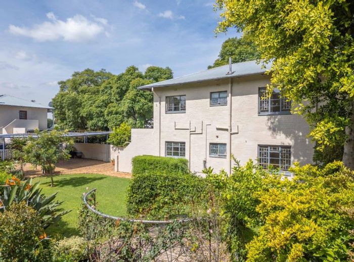 For Sale: Apartment in Modderfontein with private garden, double carport, and secure complex.