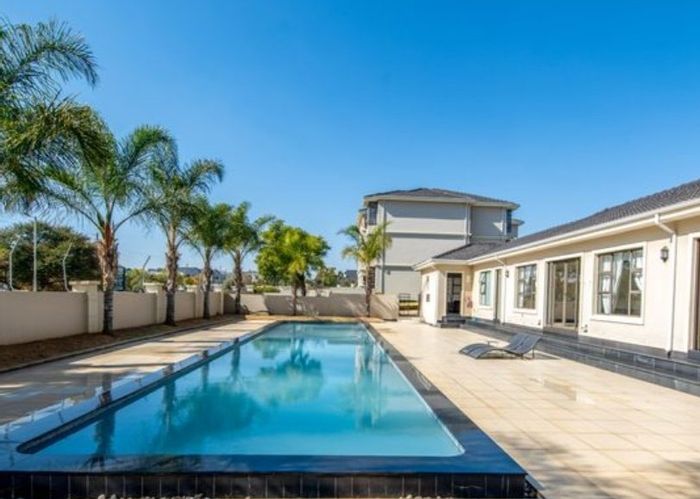 For Sale: 2-Bedroom Apartment in Summerset with Garden, Carport, and Secure Estate Access.