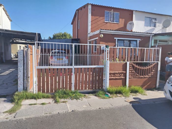 Two-Bedroom House for Sale in Lotus River with Spacious Yard and Secure Parking.