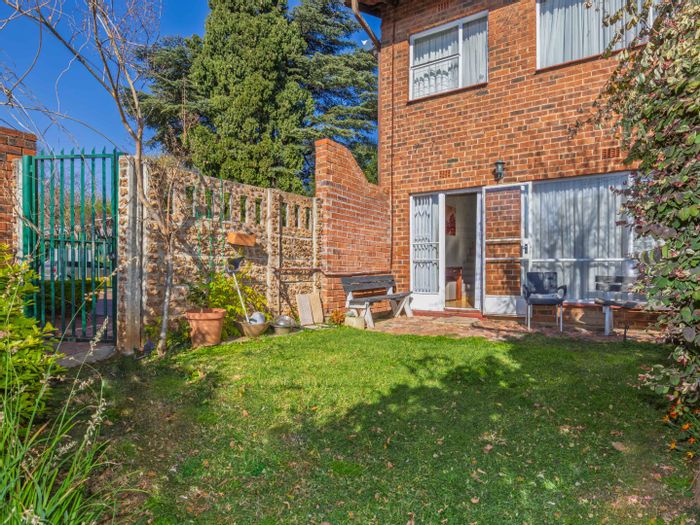 For Sale: Townhouse in Bedford Gardens with private garden and parking bays.