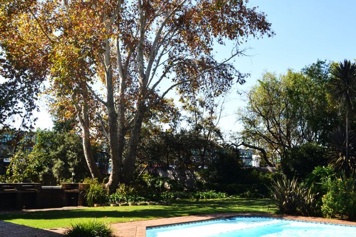 Craighall Apartment For Sale: Spacious with balcony, pool, and secure parking.