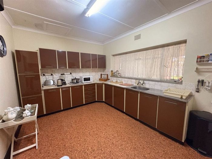 Northmead House For Sale: Spacious 3-bedroom, multiple living areas, 4 carports.