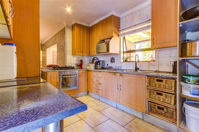 For Sale: Spacious 4-bedroom house with pool, staff quarters, and double garage in Kempton Park West.