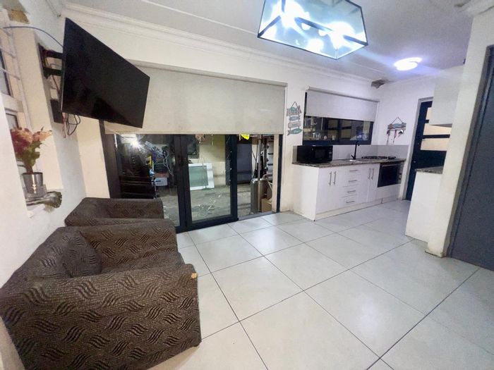For Sale: House in Harmony Village with garage, borehole, and versatile fourth room.