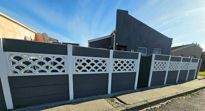 For Sale: Spacious 4-bedroom house in Strandfontein Village with garage and dual access.