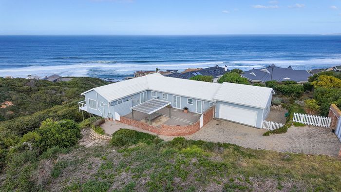 For Sale: House in Dana Bay with ocean views, outdoor entertainment, and security features.