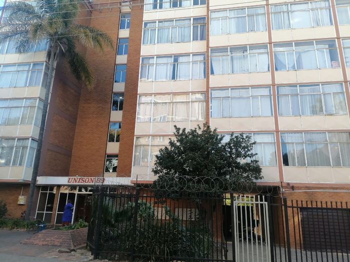 3-Bedroom Apartment For Sale in Sunnyside with garage, pool, and braai area.