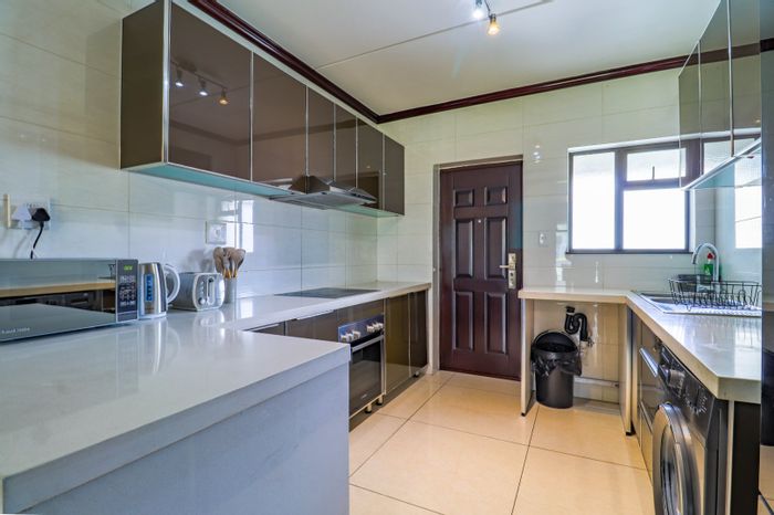 Maroeladal Apartment To Rent: 2 beds, balcony, modern kitchen, near amenities.