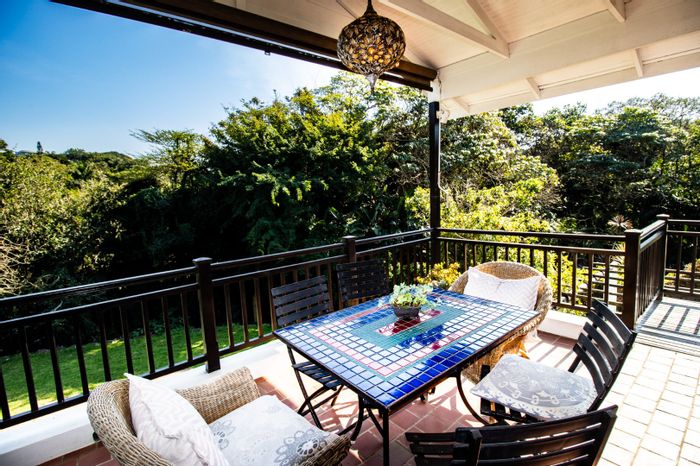 For Sale: House in Salt Rock with expansive living, two flatlets, and lush gardens.