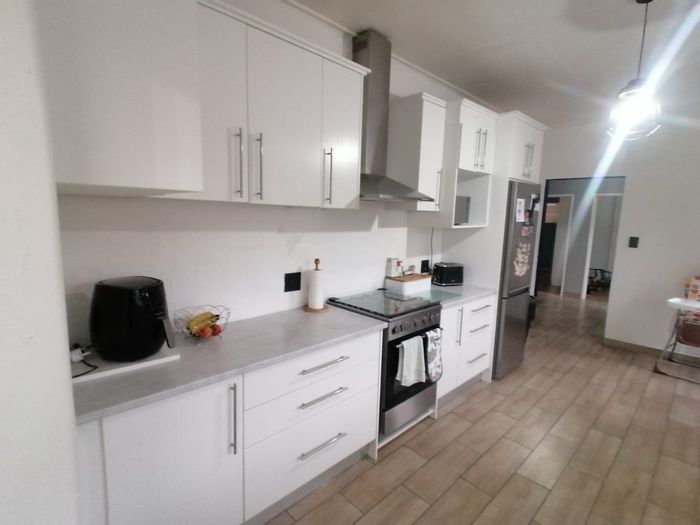 For Sale: House in Peerless Park with 3 bedrooms, double garage, ample yard space.