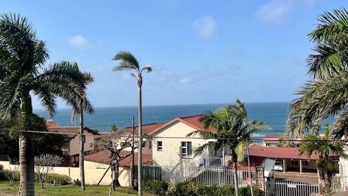 Beachfront apartment in Uvongo Beach for sale with pools and braai areas.
