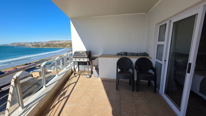 For Sale: Apartment at Diaz Beach with sea views, balcony, and included furniture.