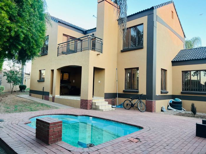 For Sale: Spacious 4-bedroom house in Noordwyk with pool and security features.