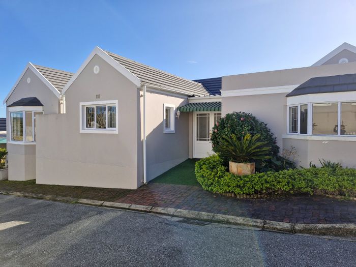 For Sale: House in Hunter Village with 3 bedrooms, lagoon views, and secure community.