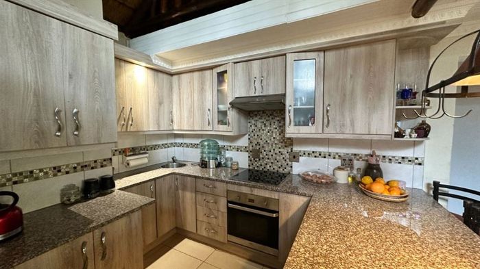 Klippoortjie Townhouse For Sale: 2 Bedrooms, pool, carports, open-plan living.