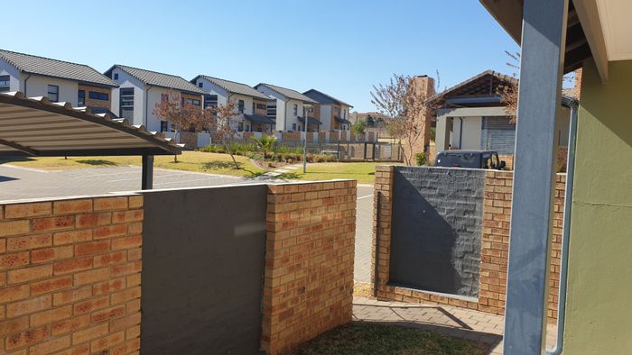 3-Bedroom Townhouse For Sale in Amberfield with garden, carport, and estate amenities.