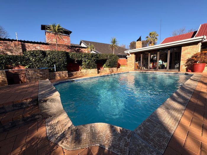 For Sale: House in Stilfontein Ext 4 with pool, flat, and ample security features.
