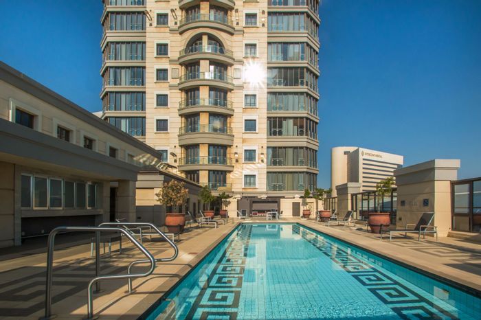 Executive Sandton Central Apartment For Sale: High-Floor Views, Pools, Gyms, Direct Mall Access