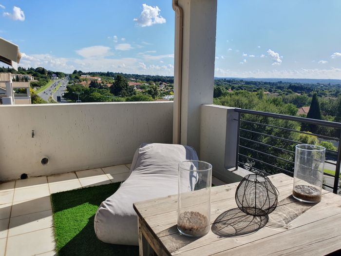 Bryanston Apartment To Rent: Open plan, loft, balcony, pool, and cat-friendly.