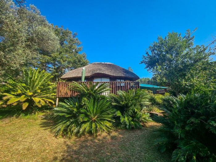 Farm for Sale in Sabie Central: Waterfall views, self-catering chalets, and guest house.