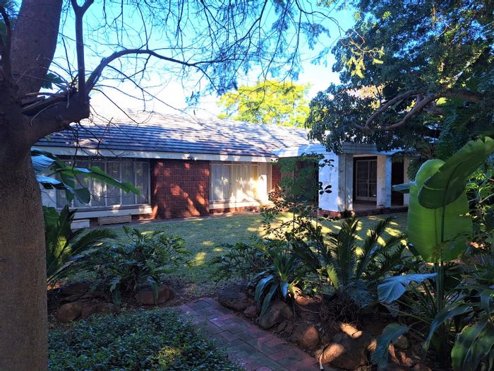 For Sale: House in Alphen Park with development potential, double garage, and spacious layout.