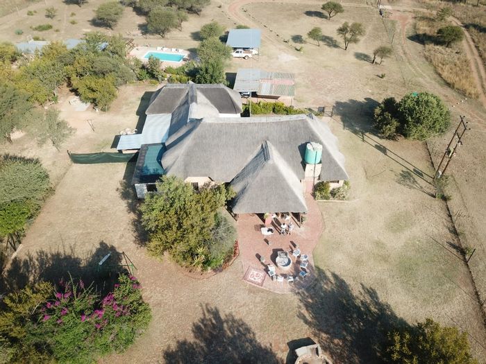 For Sale: Farm in Dinokeng Game Reserve with lodge, amenities, and income potential.