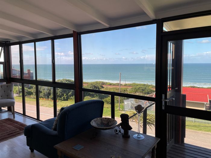 Ocean views, dual kitchens, gardens, and garage in Reebok house for sale.